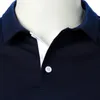 Herrpolos män t-shirt kort ärm två färg skarv urban affärspolo casual mode lapel topp