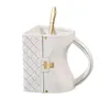 Tassen Kaffeetasse Teetasse Set Tassen Keramik Reisehandtasche geformt mit Löffel für Frauen 231116