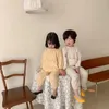 パジャマ春夏の子供の女の子のキャンディーカラーパジャマセット。toddlerキッドポケットパジャマセットフラワーズホームスリープウェア。