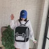 Children's Schoolbag ulzzang graffiti black-and-white drawing paper 2D cartoon Men and women backpack For Teenage Girls239h