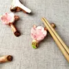 Chopsticks Creative Cherry Blossoms Chopstick Rest Rack Splank Stand Pen Holder Holder Telare tabel Decoratie