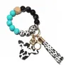 Keychains Cow Aangepaste siliconen kralen lederen kwastje schattige koe houten stier houten kralen armband siliconen polsklet sleutelhanger