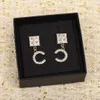 2023 Boucles d'oreilles pendantes de charme de luxe avec diamant en plaqué or 18 carats avec timbre Conception de forme carrée PS7865A