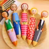 Cartoon Doll Design Ballpoint Pen School Rewards levererar eleverna Kawaii Blue Ink Rollerball Big Writing Stationery Kid Toy