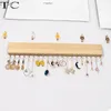 Smycken påsar kreativ vägg hängande halsband örhängen förvaring rack solid träglist display