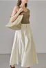 Saias 2023 Cantura alta feminina Salia plissada Primavera e verão Versátil Fashion Ladies Color Solid Long Jupe com bolso