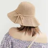 Chapéus largos da borda Mulheres Summer Summer Travel Straw Hat Straw Bow Wavy Big Cool Fashion Moda dobrável Pesca Pescador Cap vestuário férias de férias