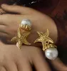 Boucles d'oreilles à tige lumière luxe mode exagérée européenne et américaine en laiton étoile de mer rétro perle oreille Clip