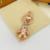 Designer Cartoon Keychain Luxury Women Mens Keyring High Quality Car Keyring Lover Gold Black Metal Small Jewelry Charm Bag Pendant Jewelry Good Gift 2311175D