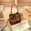 Designer-Handtasche Hong Kong Einkäufer echtes Leder neue Nische Damen tragbarer Eimer ausländischer Stil One-Shoulder-Umhängetasche kleine Tasche