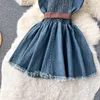 Sukienki swobodne mody streetwear dżinsowa sukienka spaghetti Pasek Krzyż koronkowy w górę Bow Belt Zipper Pleted Women American Vintage Mini sukienka 2024
