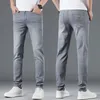 Męskie dżinsy wiosenne lato cienki dżins Slim Fit European American High-end marka małe proste spodnie HX9319-2