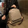 デザイナーハンドバッグ香港女性の新しいバックパックファッションシンプルな大規模旅行バッグ本物の革の通勤バックパック