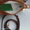 High quality Clearance Wholesale wallet Nylon Dumpling Bag %95 Off Wholesale sac 2024 Short Handle Hand Contrast Cosmetic Cognac Color Hand Mini handbag