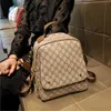 デザイナーハンドバッグ香港女性の新しいバックパックファッションシンプルな大規模旅行バッグ本物の革の通勤バックパック