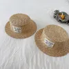 Cappelli Cappelli Cappelli estivi per bambini Cappello di paglia con etichetta Stile coreano Cappello a cilindro in paglia di grano Ragazzi Ragazze Cappello con visiera parasole Protezione solare Cappello da spiaggia per bambini 230418