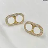 Designer clássico Diamond Studs Brincos de designer femininos Gold de cristal elípticos de ouro com caixa