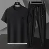 Męskie dresy letnie męski jedwabny kombinezon męski swobodny, cienki, cienkie spodnie T-shirt Dwuczęściowy zestaw wysokiej jakości trendu oddychającego Trend Trend 230418