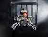 悲鳴を上げるアニメーションハロウィーンの飾りハロウィーンの装飾のモーションセンサーと光る怖い頭蓋骨ケージ囚人ホーンテッドハウスD8704469