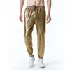 Pantalon pour hommes Glossy Gold Metallic Jogger Men Hop Hop Steampunk Nightclub Pantalon Homme Mens Disco Party Stage Pantal