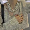 Choker Französische Retro-Perlenkette für Frauen mit hervorragendem Design, halbrunde, mehrschichtige Kragenkette aus Metall