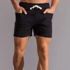 Shorts masculinos shorts shorts homens com bolsos dianteiros homens shorts gináste fitness use shorts de suor de algodão puro homens moda moda sportswear Bottoms 230419