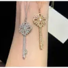 Necklaces Ism Necklace T Snowflake Key Necklace with Full Diamond Iris Suower Pendant Sweater Chain for Women
