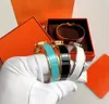 Högkvalitativ designer Design Bangle rostfritt stål Guldspänne armband Modesmycken Män och kvinnor armband 17cm 19 cm