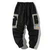 Pantaloni da uomo Hip Hop Uomo Multi-tasca Elastico in vita Design Harem Pant Street Punk Hip Hop Pantaloni casual Pantaloni da jogging Pantaloni cargo maschili ABZ51 230418