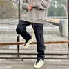 Designerkläder Fritidsbyxa RHUDE Funktionell arbetsdräkt för män med flera fickor Spänne Rakt rör Lös Mode Arbetsdräkt Svarta byxor Streetwear Jogger