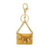 Sac Pendentif Porte-clés Anneaux Fleur De Camélia 5 Tour Eiffel Caméra Goutte D'eau Diamant Charme Porte-clés Titulaire De Mode Strass Porte-clés Femmes Bijoux Accessoires