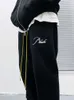 Roupas de grife Calças casuais de tendência Marca RHUDE Bordado Calças com cordão Nevoeiro Calças casuais masculinas femininas Calças outono inverno streetwear