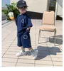 Наборы костюмы детей для гольф -одежды 2023 Модная детская одежда для мальчиков летняя костюма шорты с коротким рукава