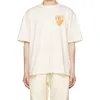 デザイナーファッション衣類 Tシャツヒップホップ Tシャツ Rhude 新しい黄色バッジ夏ルーズカップル半袖純粋な綿メンズ半袖 Tシャツトレンドルーズストリート