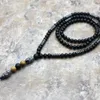 Collane con ciondolo Design Ematite da uomo nera naturale che intaglia Collana di perline di Buddha Goccia di gioielli di moda