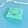 Pulsera de brazalete Tiffanyany T S925 Pulsera de plata esterlina Serie de ropa rígida Bola redonda que rodea la moda abierta Fashion Simple Versátil