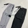 Stones Island Marque Designers Pantalon Pierre Métal Nylon Poche Badge Pantalon Occasionnel Mince Réfléchissant 929 256