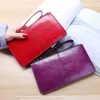 Plånböcker Kvinnors vintage oljevaxläder dragkedja handväska bank stor kapacitet noll plånbok handledsrem enkla namn påsar korthållare