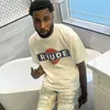 デザイナーファッション衣類 Tシャツ Tシャツ Rhude ハイストリート夏ヴィンテージレタープリントレーサーメンズレディースリラックス半袖 Tシャツトップスコットンストリート