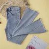 Jeans femininos primavera verão mostrar luz fina de cintura alta apertada feminina lado perfuração rebarbas ligeiramente queimadas calças