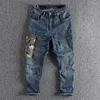 Mäns jeans rak Haren Camouflage Pocket Splice broderade denim byxor vintage tvättade lösa byxor man