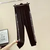 Женские брюки Capris контрастные панели Sweat Antants Женщины повседневные брюки гарема свободны упругие брюки.