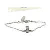 Hohe Version Western Kaiserinwitwe Vivian Light Luxus Mode Literatur Perle Schwarz Niet Saturn Silber Armband Weiblich