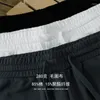 メンズショーツマルチポケットパンツ2023男性のためのミドルルーズの黒と白のソリッドカジュアルランニングスポーツ