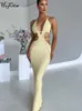 Robes Décontractées Hugcitar Crochet Halter Sans Manches Dos Nu Solide Évider Bandage Sexy Mince Maxi Robe De Bal Festival D'hiver Tenue De Fête 230421