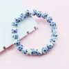 Bracciale elasticizzato con perline di porcellana bianca e blu in ceramica cinese