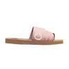 Luxurys Designers شباشب نسائية خشبية مسطحة بغل في قماش صيفي صنادل مطاطية للشاطئ أحذية منسوجة بمقدمة مفتوحة بأحرف غير رسمية