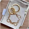 Bilnyckel Keychains Top Lanyards Designer CARABINER MENS ANAGRAM Pendants Chain Lover Par Väskor Luxury Metal Keyrings Sier Gold Drop DHEP3