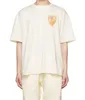 Abbigliamento di moda firmato T-shirt T-shirt Rhude T-shirt a maniche corte con stampa emblema giallo Bianco Mezza manica allentata Puro cotone Top estivo da uomo alla moda Streetwear