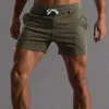 メンズショーツ男性男性弾性ウエストストレートストレッチスポーツトレーニング用スタイリッシュな短いパンツ